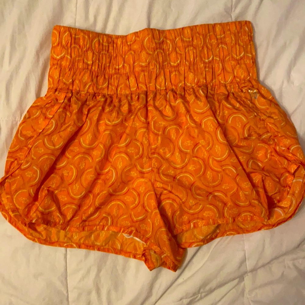 Free People movement orange shorts size XL has design with logo of Free People.